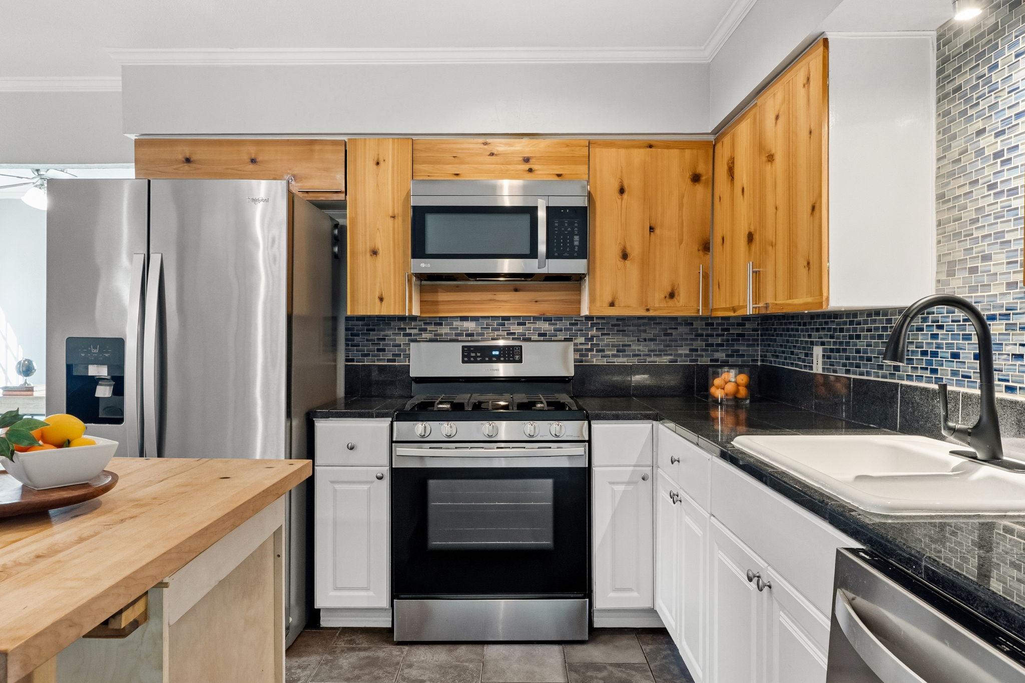 403 Gate Tree Lane Austin, TX 78745 - Photo 12 of 30 a kitchen with stainless steel appliances granite countertop a stove a sink and a refrigerator