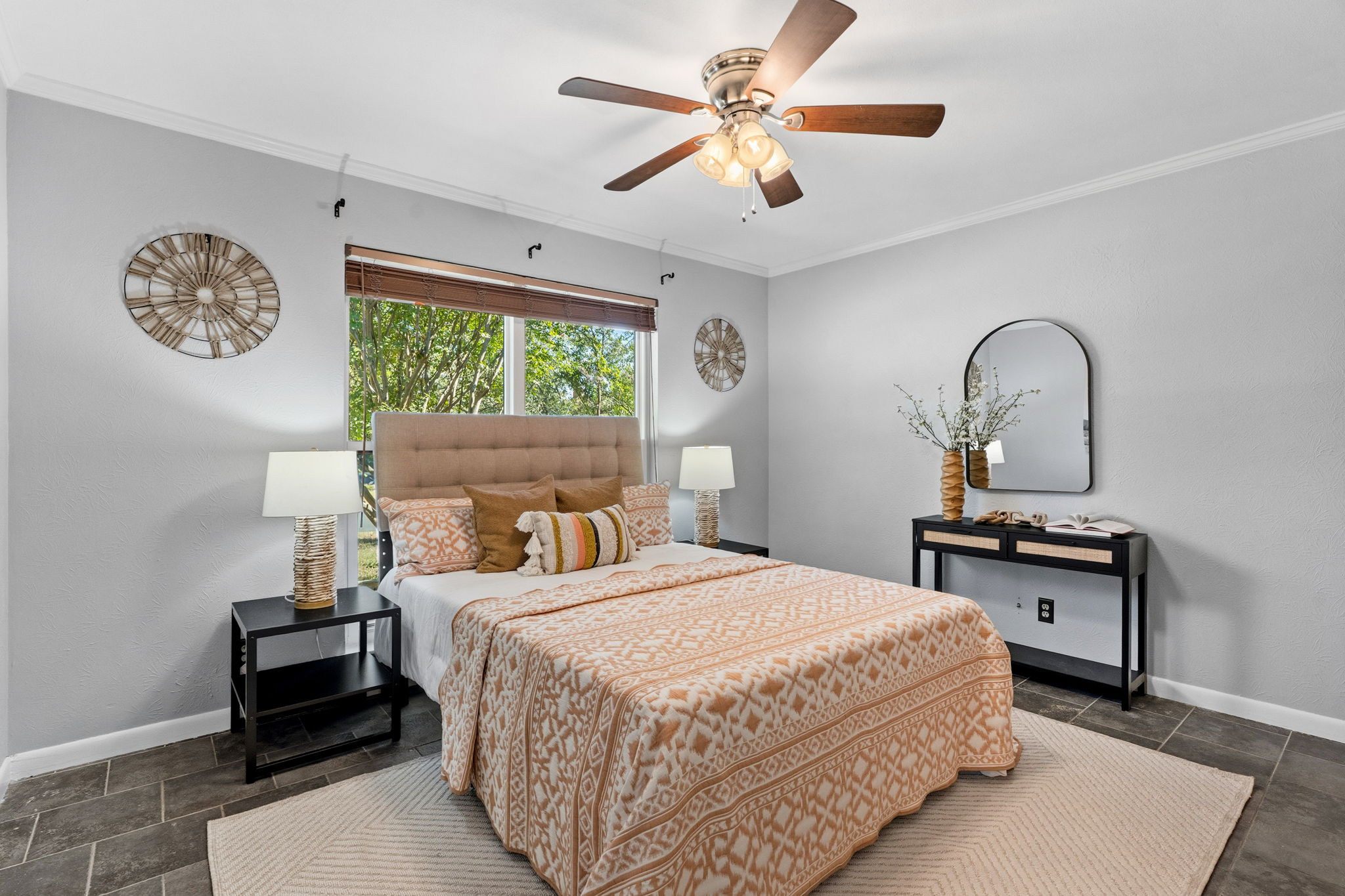 403 Gate Tree Lane Austin, TX 78745 - Photo 21 of 30 a bedroom with a bed and a chandelier
