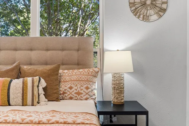 a view of a bedroom with a bed