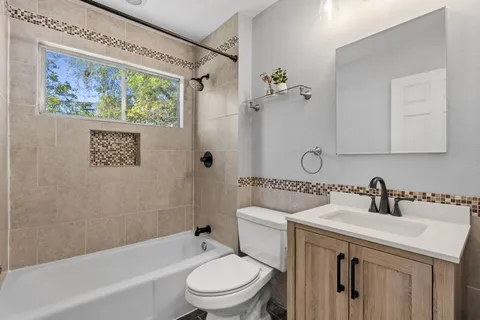 a bathroom with a toilet a sink and a bathtub