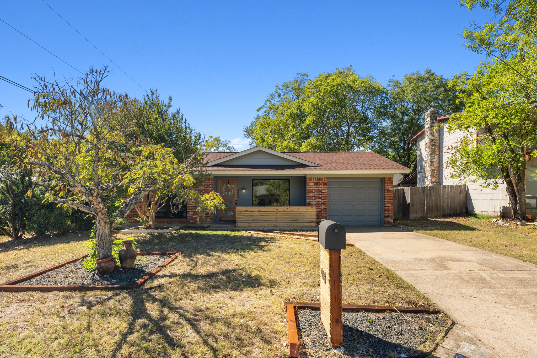 403 Gate Tree Lane Austin, TX 78745 - Photo 30 of 30 a front view of a house with garden