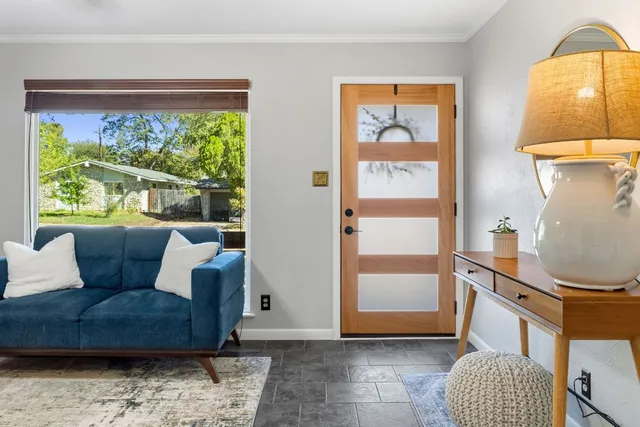 a living room with furniture and a window