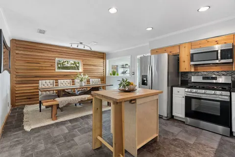 a kitchen with a stove and a refrigerator