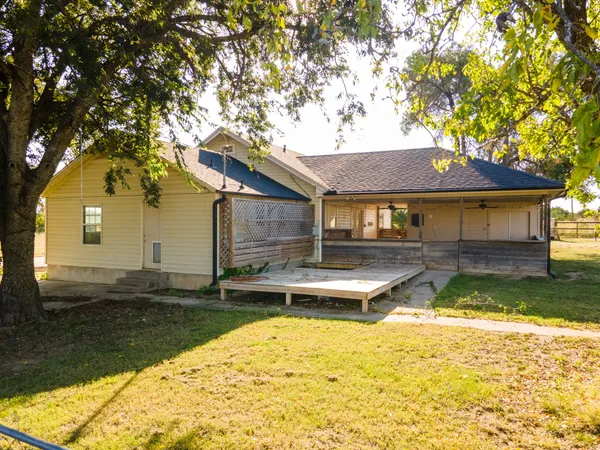 a view of a house with swimming pool