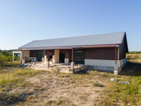 a front view of house with outdoor seating