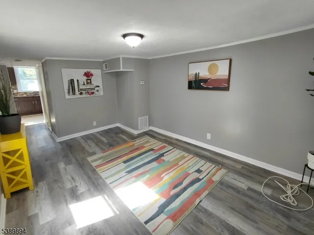 a bedroom with a bed and a lamp on table