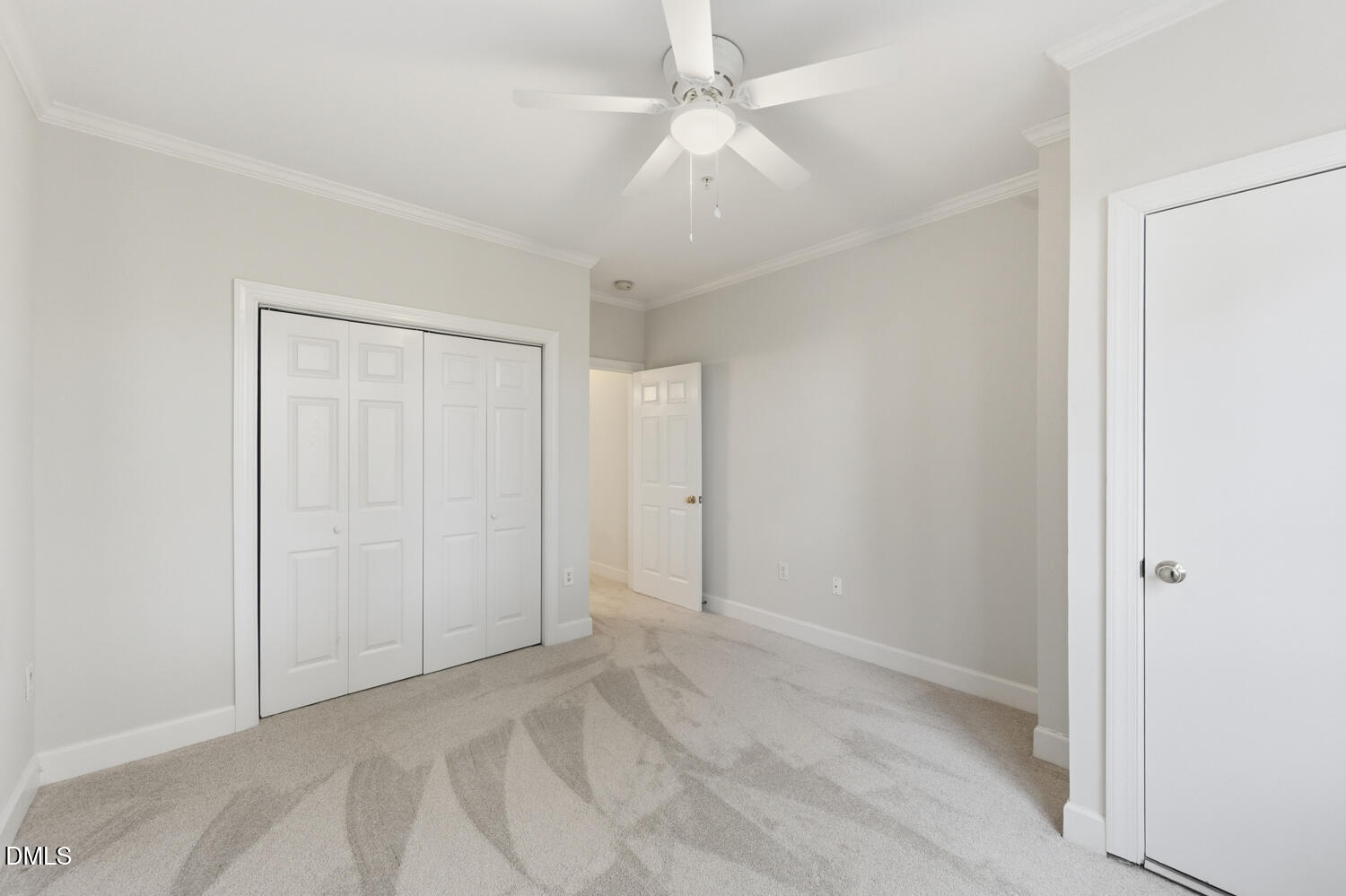 116 Northbrook Drive, Unit 204 Raleigh, NC 27609 - Photo 39 of 94 an empty room with fan and entrance
