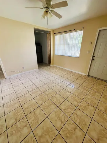 a view of an empty room and window