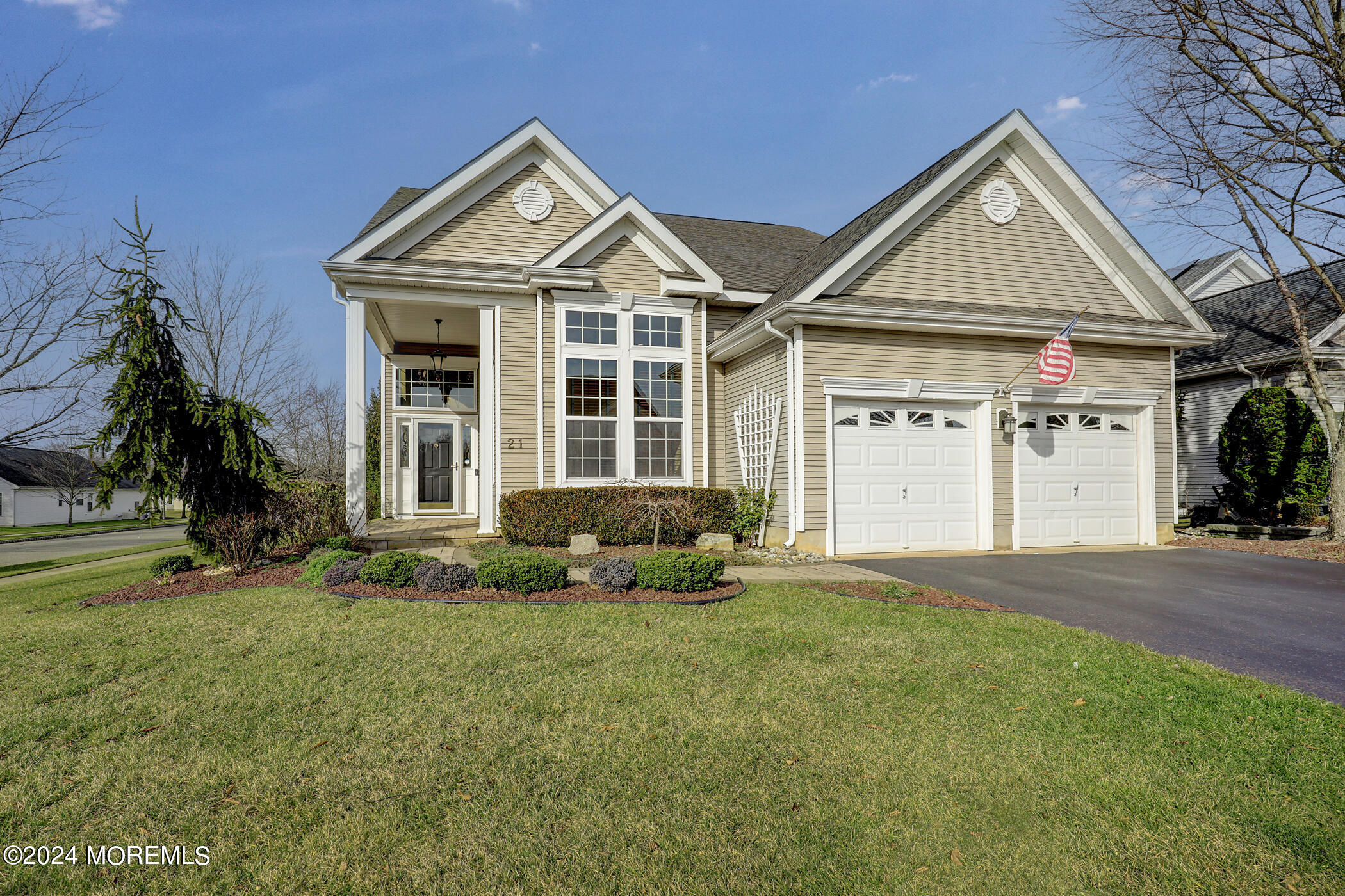 21 Hartack Road Manalapan, NJ 07726 - Photo 1 of 39 a front view of a house with a yard and garage