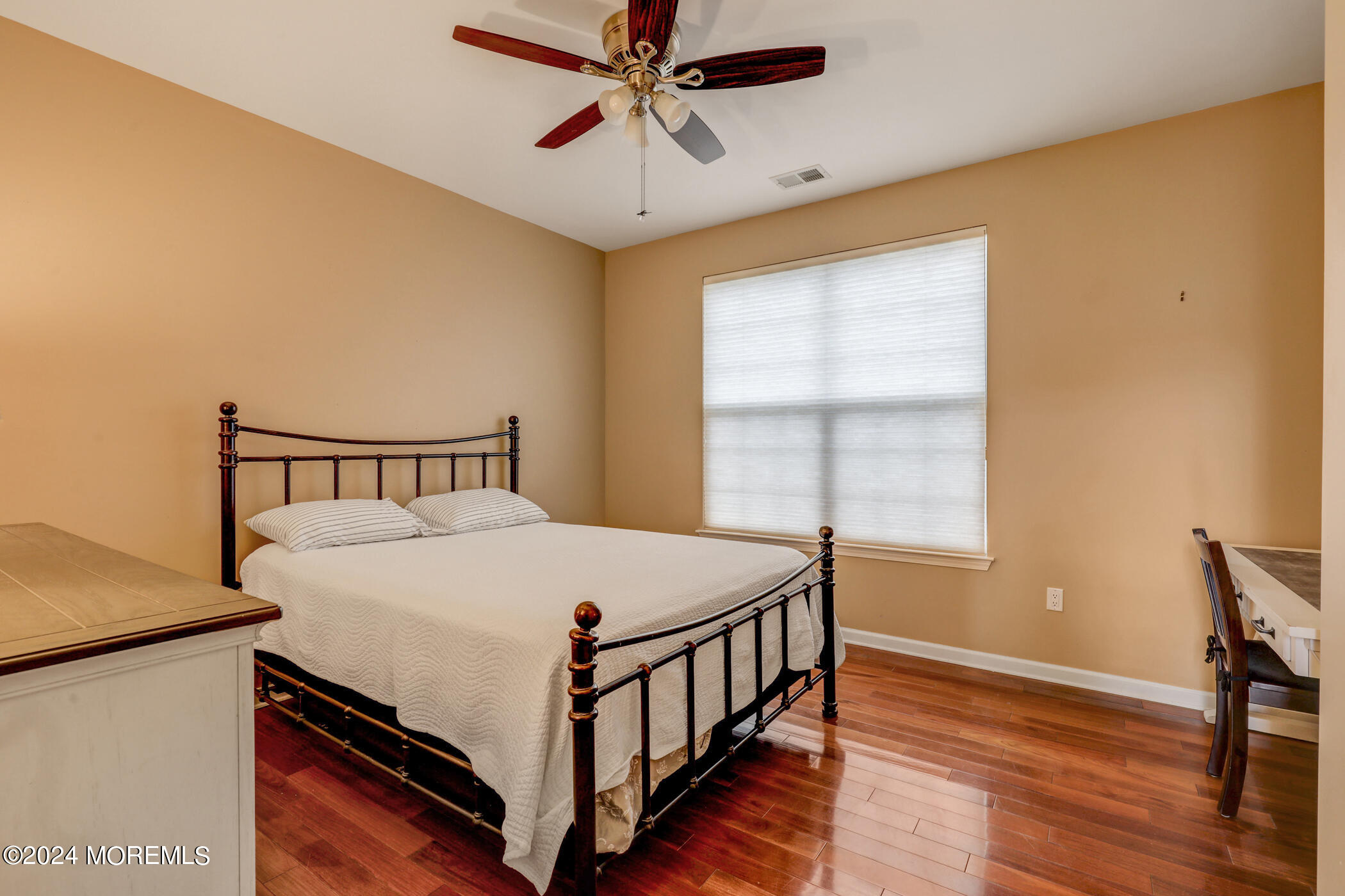 21 Hartack Road Manalapan, NJ 07726 - Photo 21 of 39 a bed sitting in a bedroom next to a window