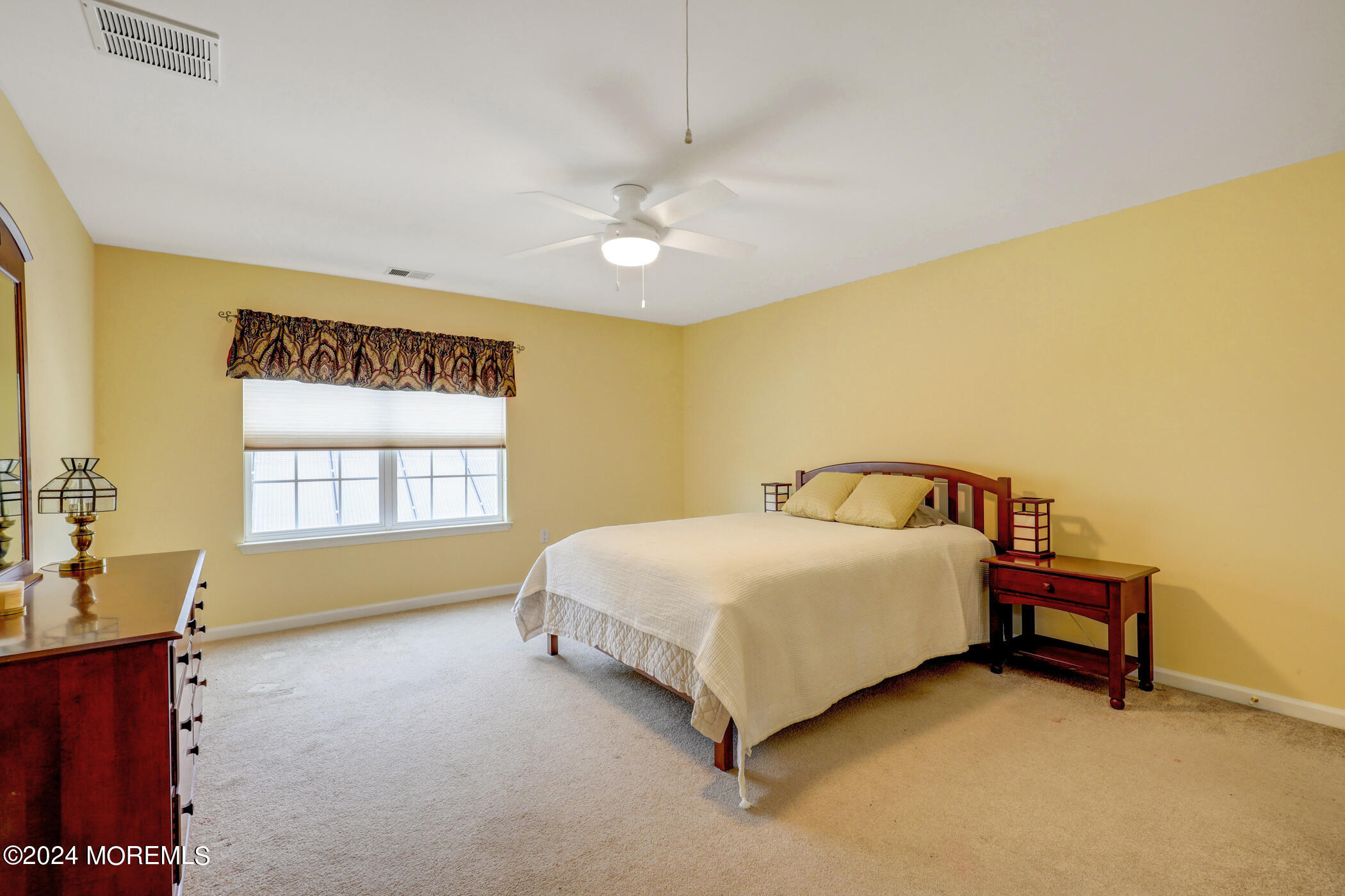 21 Hartack Road Manalapan, NJ 07726 - Photo 24 of 39 a spacious bedroom with a bed and a window