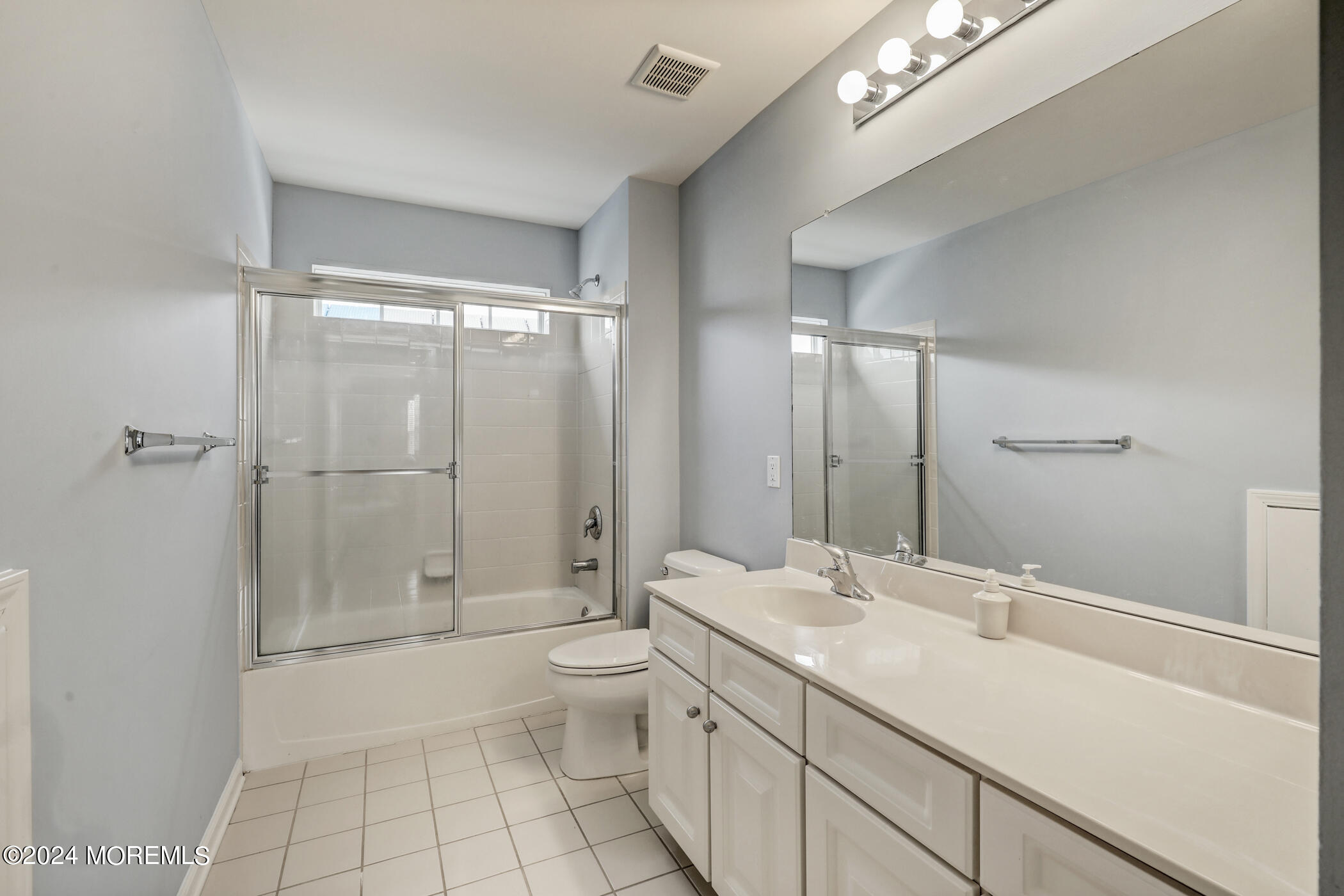 21 Hartack Road Manalapan, NJ 07726 - Photo 25 of 39 a bathroom with a double vanity sink toilet and shower