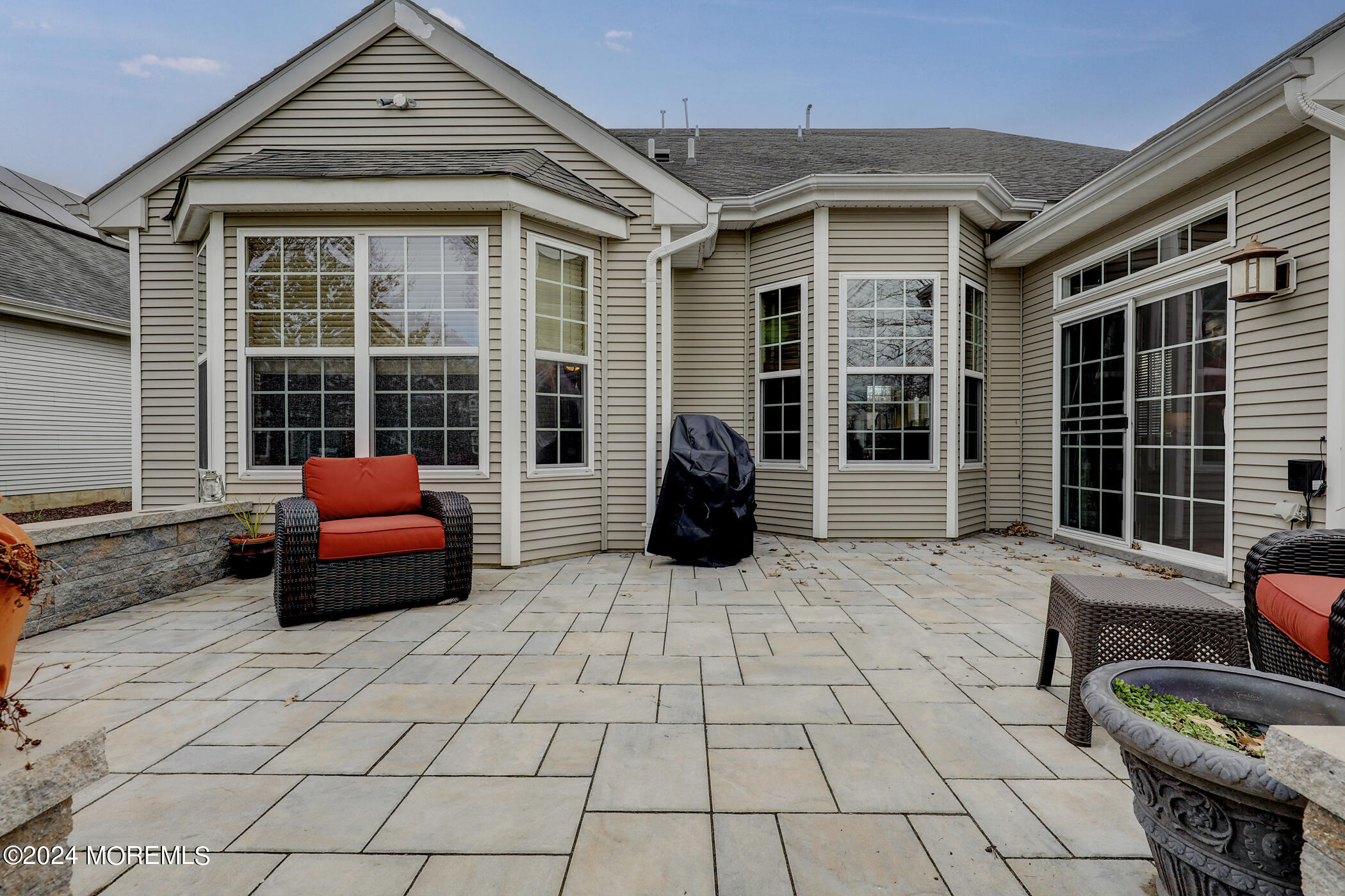 21 Hartack Road Manalapan, NJ 07726 - Photo 26 of 39 a building outdoor space with patio furniture and potted plant
