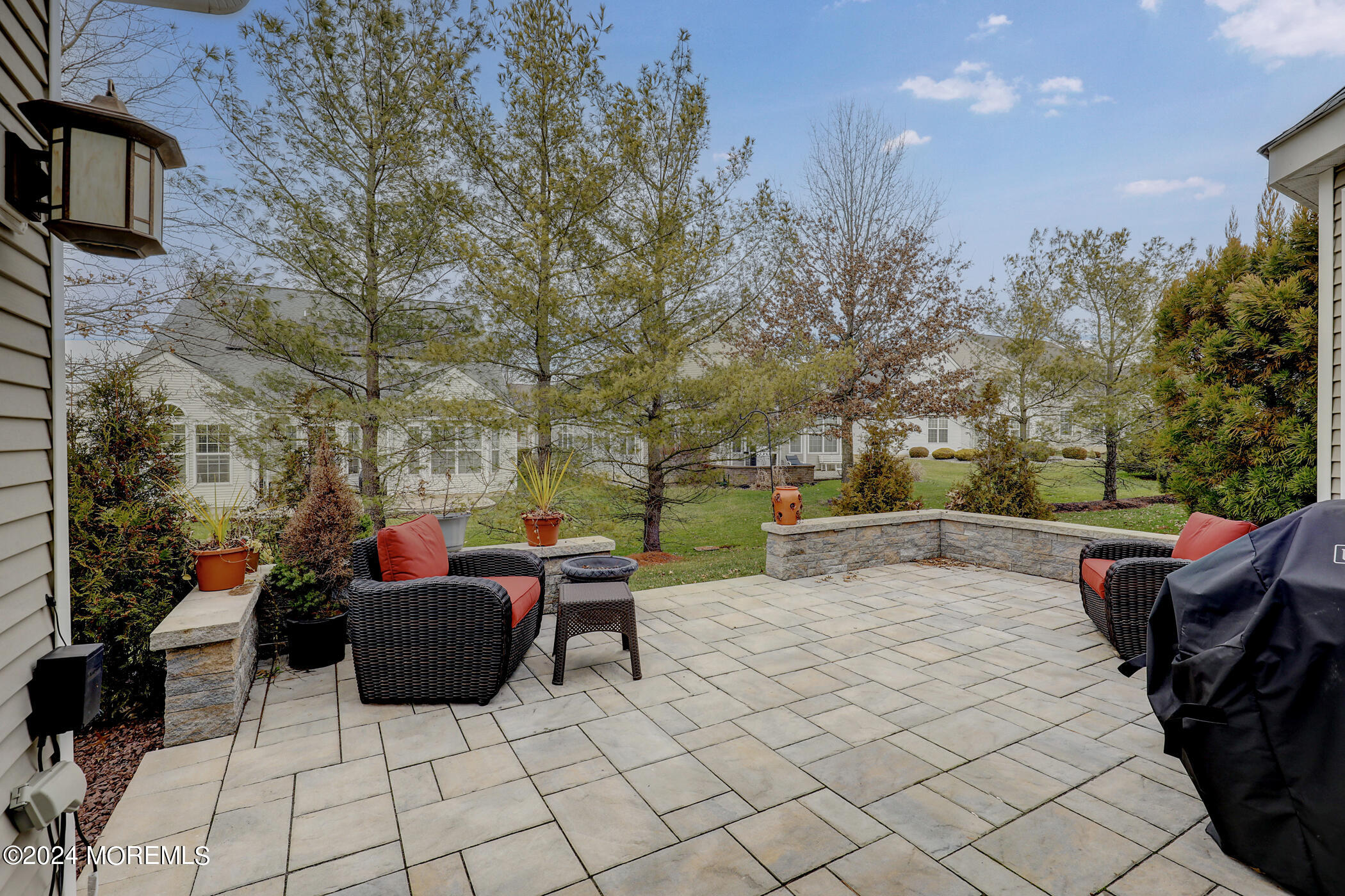 21 Hartack Road Manalapan, NJ 07726 - Photo 27 of 39 a view of a patio with table and chairs and potted plants