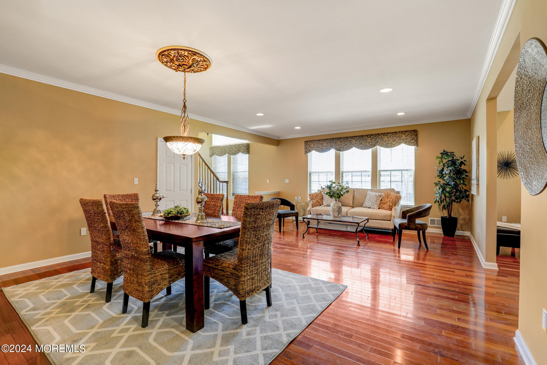 21 Hartack Road Manalapan, NJ 07726 - Photo 7 of 39 a view of a dining room with furniture and wooden floor