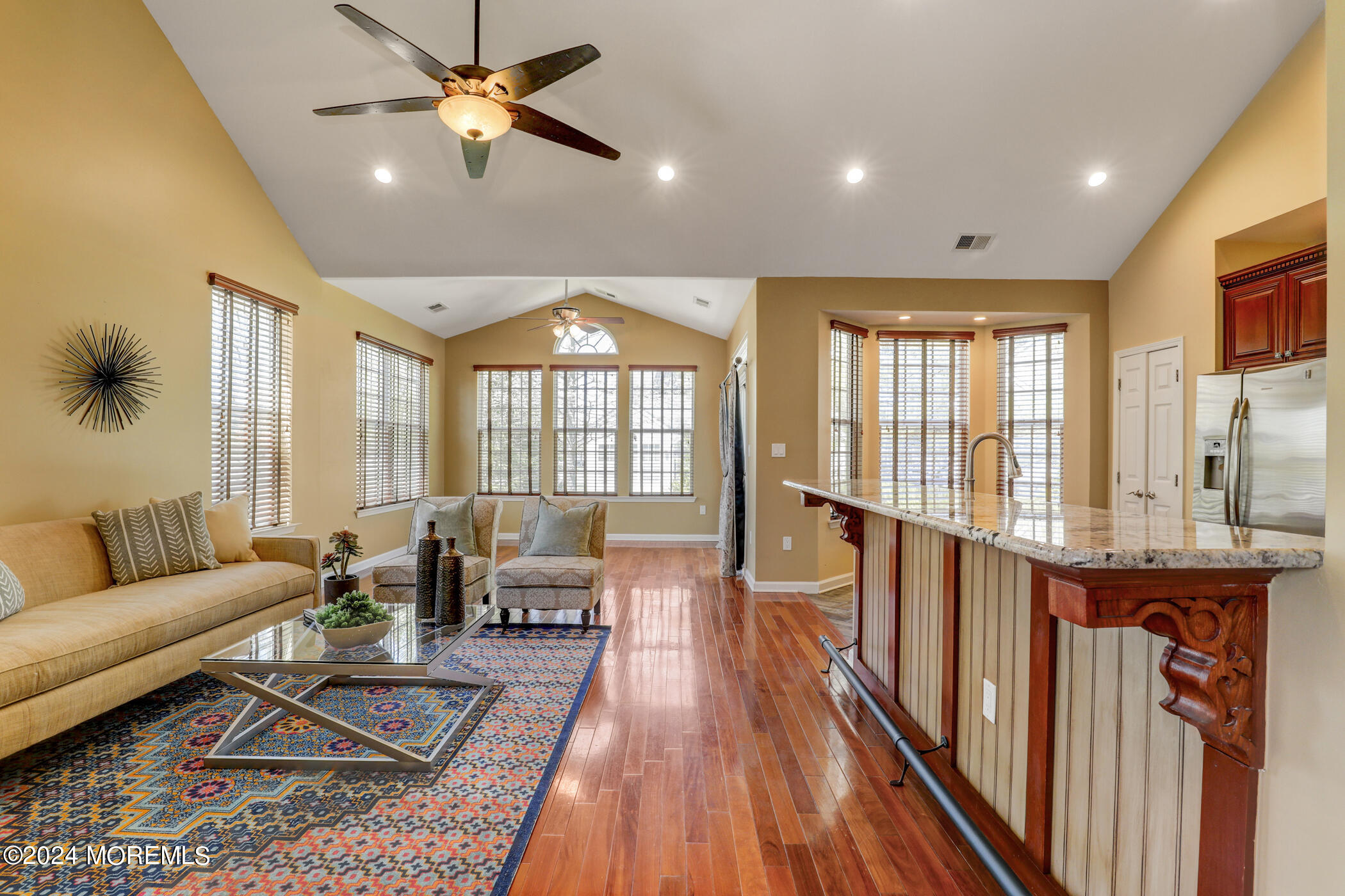 21 Hartack Road Manalapan, NJ 07726 - Photo 8 of 39 a living room with furniture and a large window