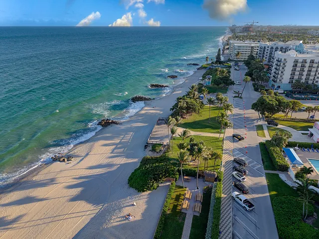 an aerial view of houses with outdoor space