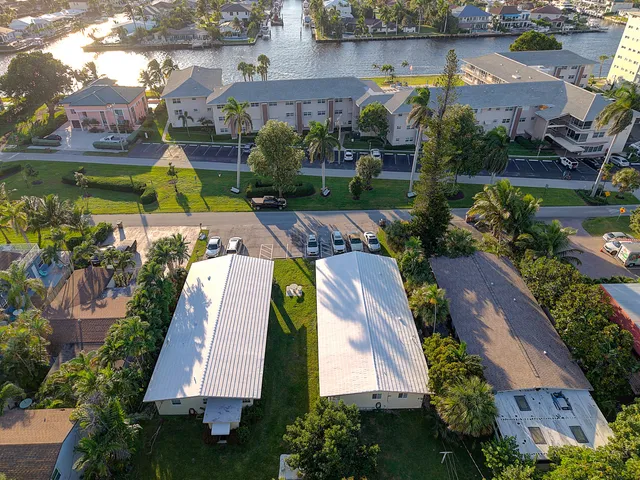 an aerial view of a house with a garden and swimming pool