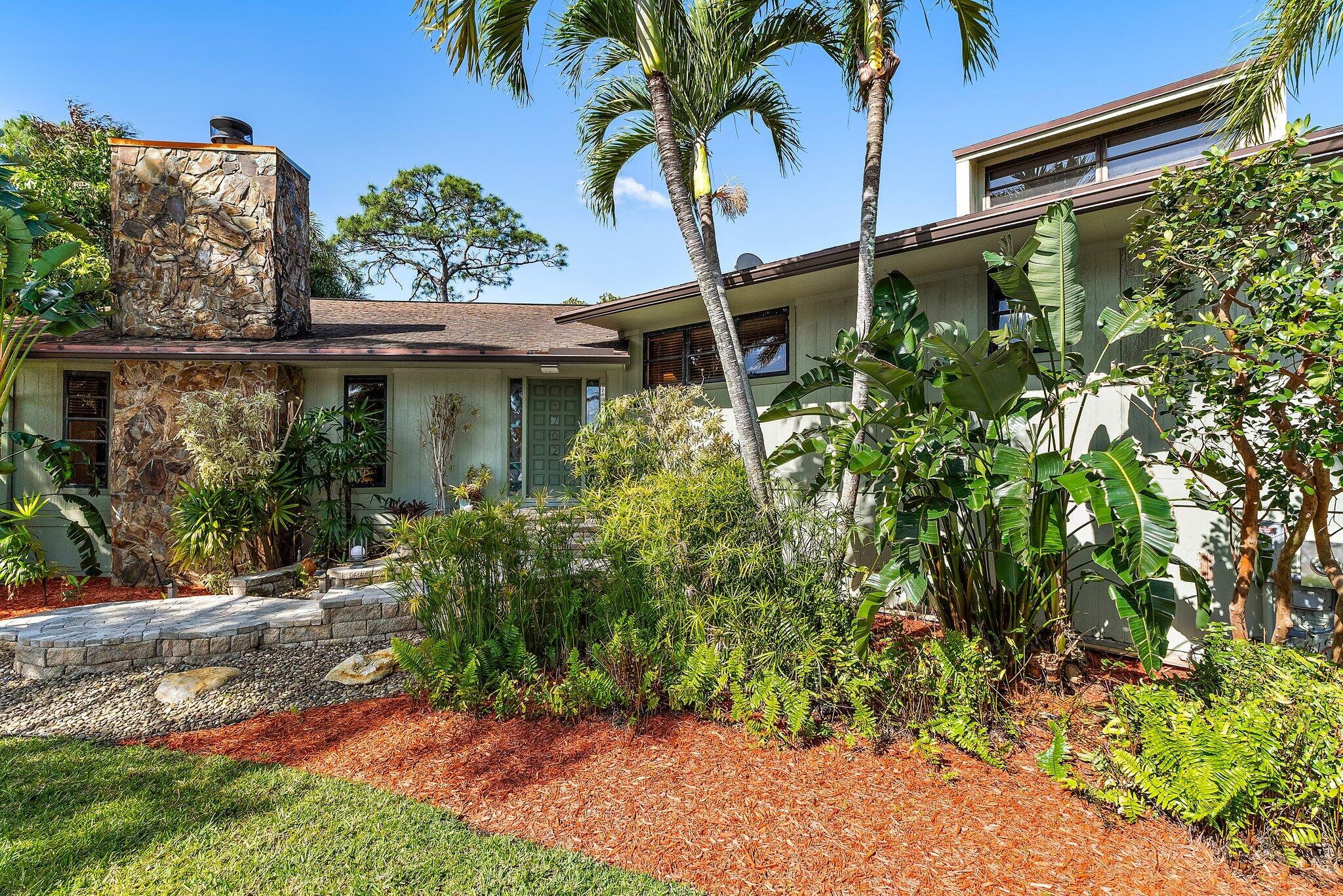 702 Warren Drive Jupiter, FL 33458 - Photo 14 of 76 front view of a house