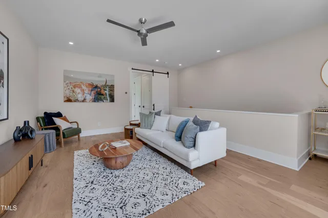 a living room with furniture and a rug