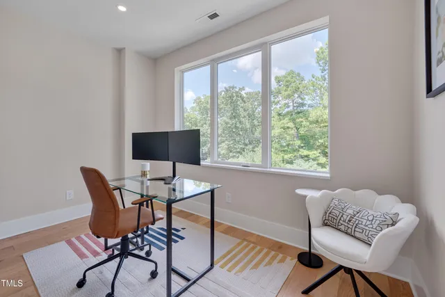 a work room with furniture and a window