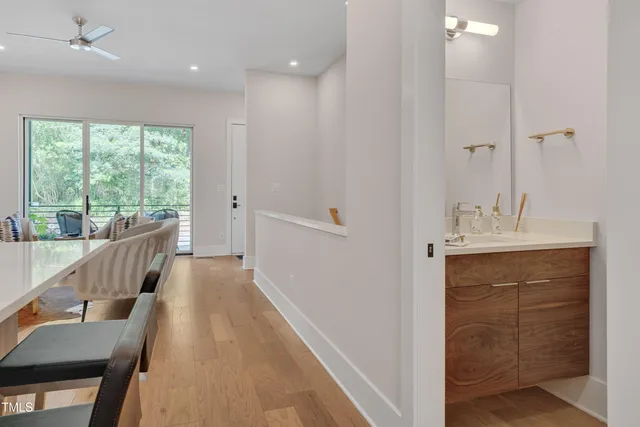 a bathroom with a sink a mirror and a bathtub