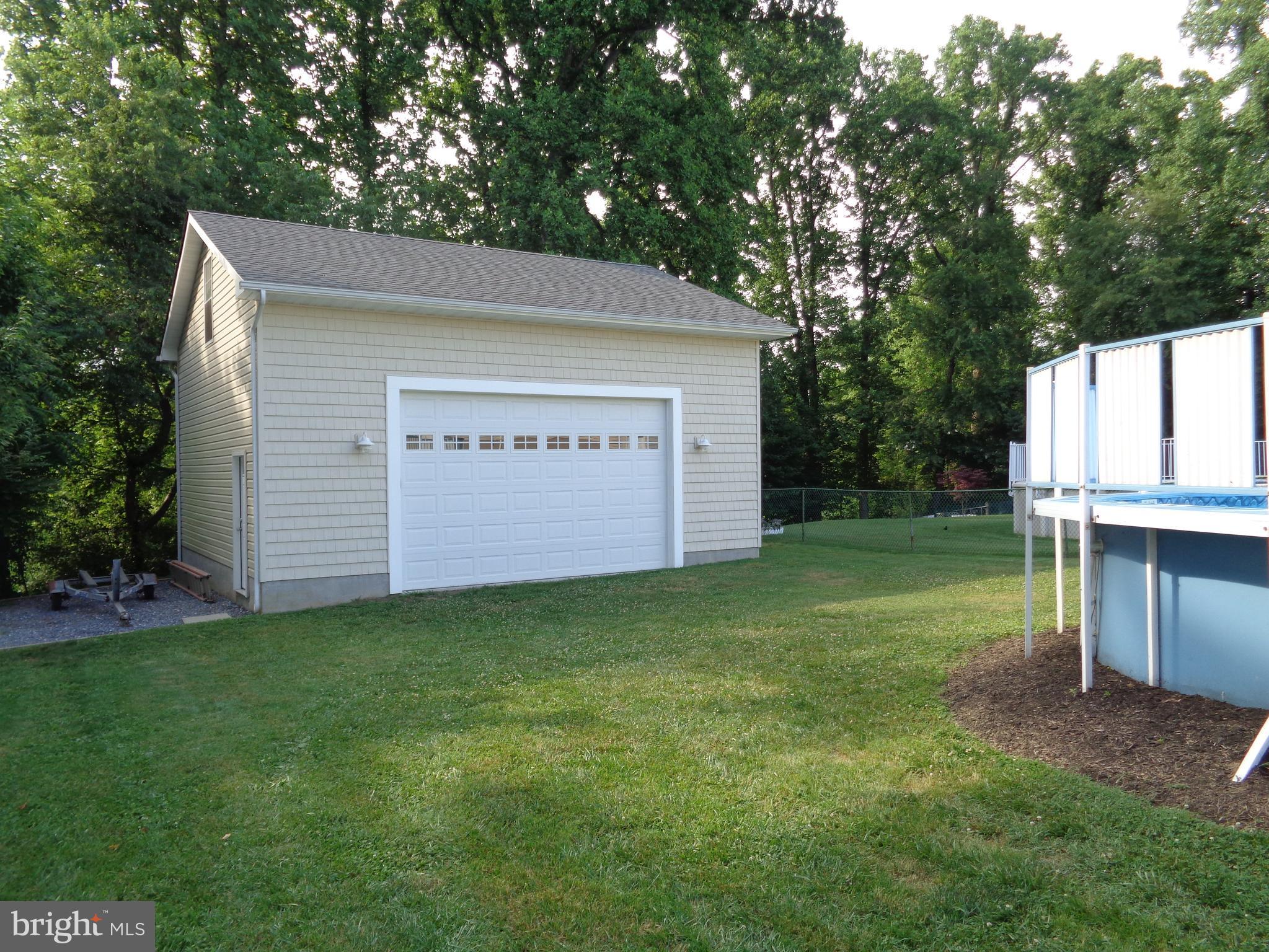 246 Arundel Road Pasadena, MD 21122 - Photo 15 of 27 2 car garage measures 26X28 with walk up loft