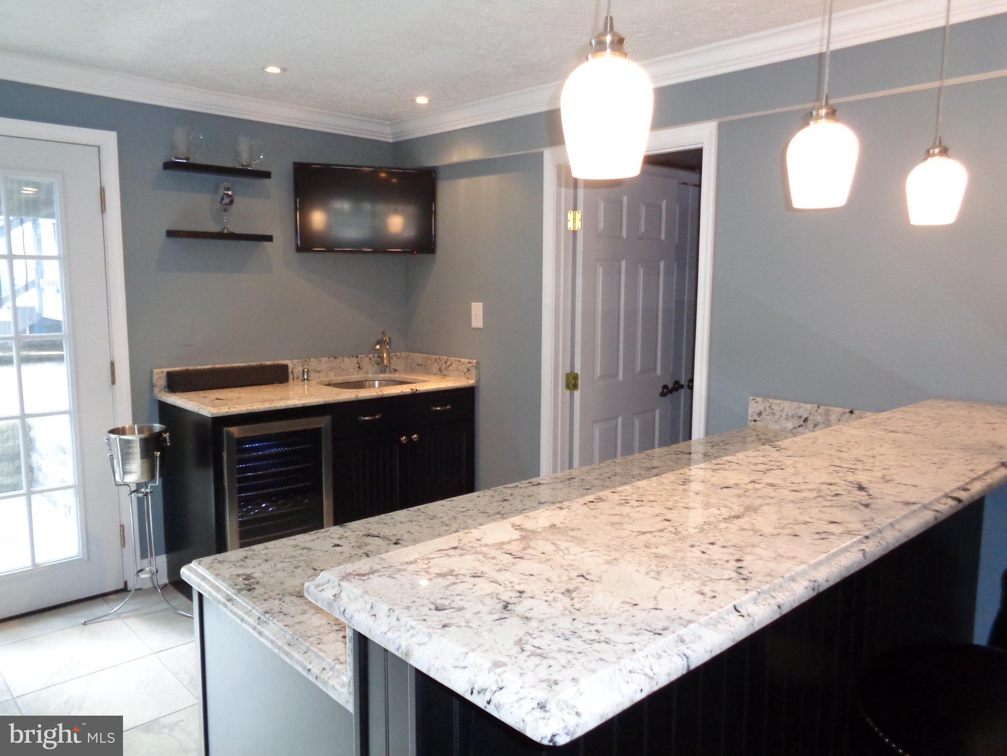 246 Arundel Road Pasadena, MD 21122 - Photo 19 of 27 Granite bar w/wine frig and wet bar