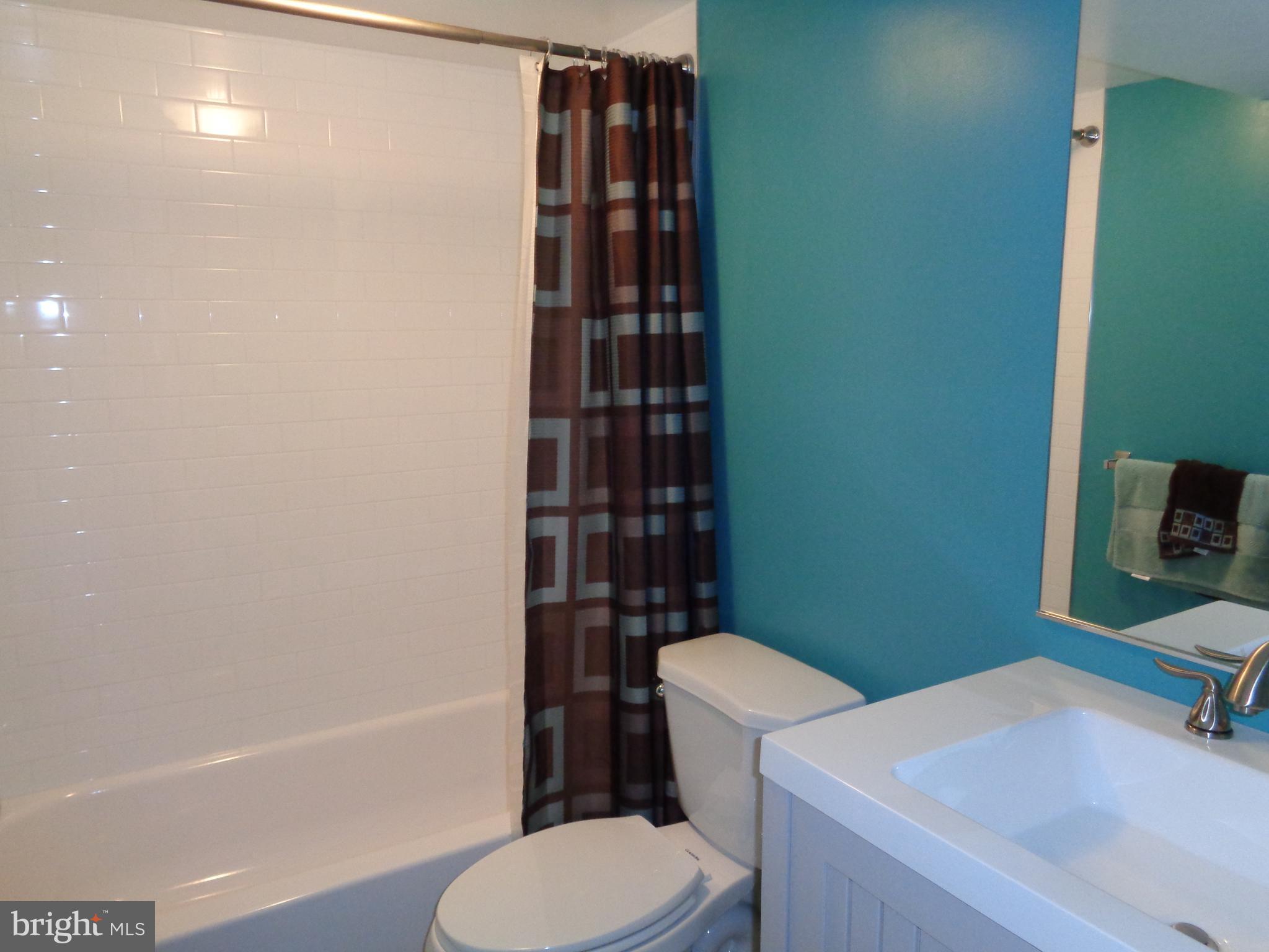246 Arundel Road Pasadena, MD 21122 - Photo 20 of 27 Lower level full bath with new tile surround