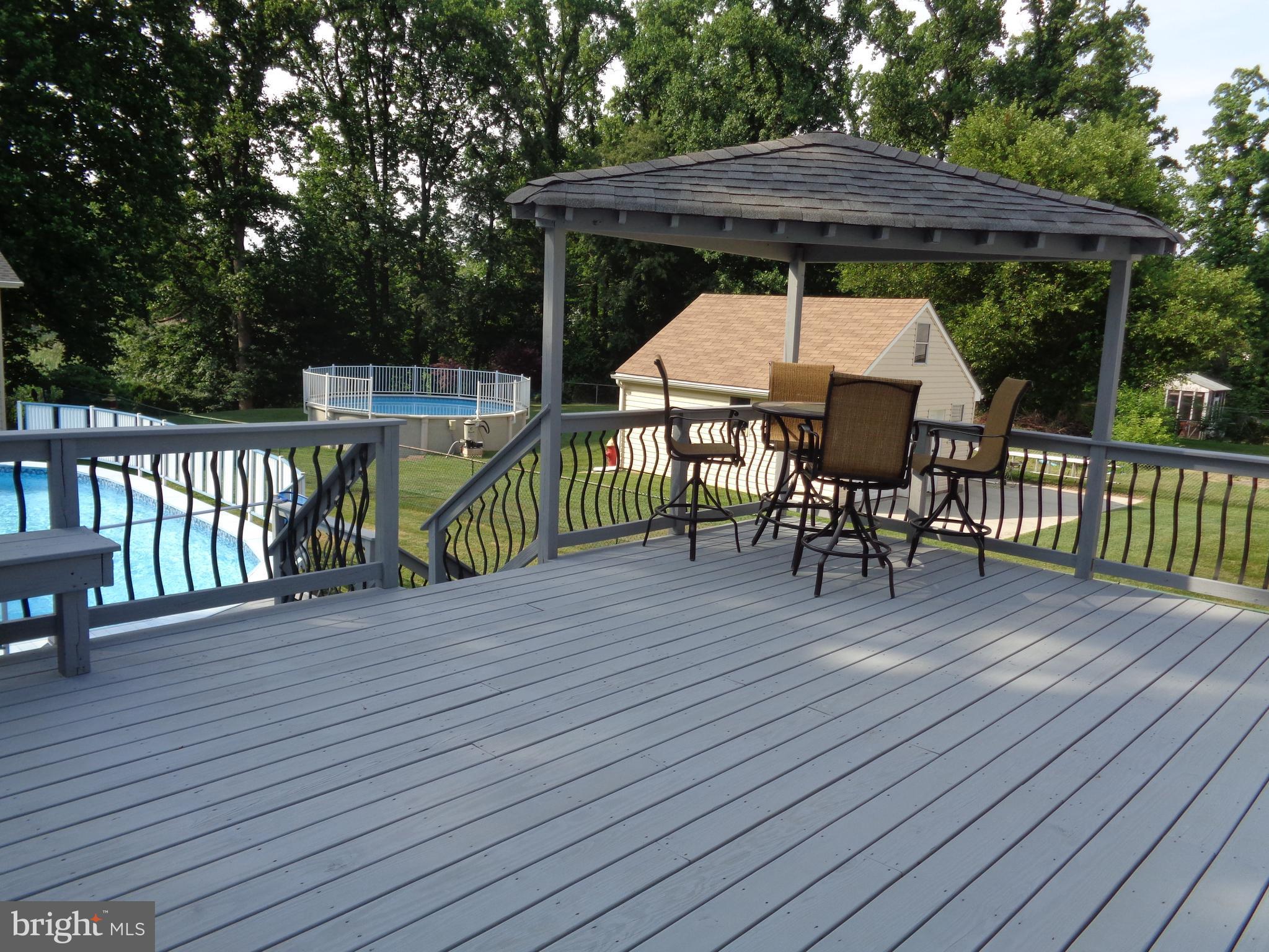 246 Arundel Road Pasadena, MD 21122 - Photo 22 of 27 Spacious deck with dining pergola