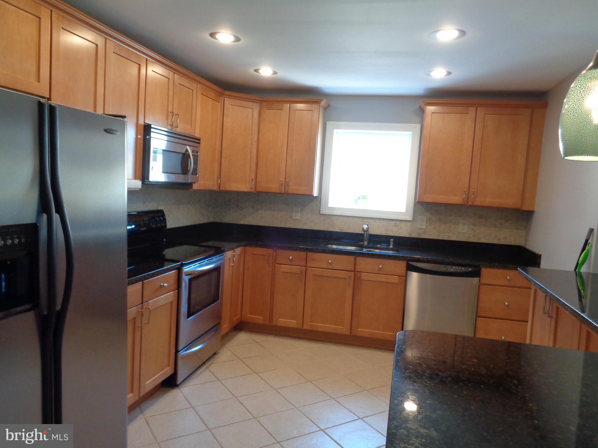246 Arundel Road Pasadena, MD 21122 - Photo 5 of 27 Stainless steel appliances and a garden window