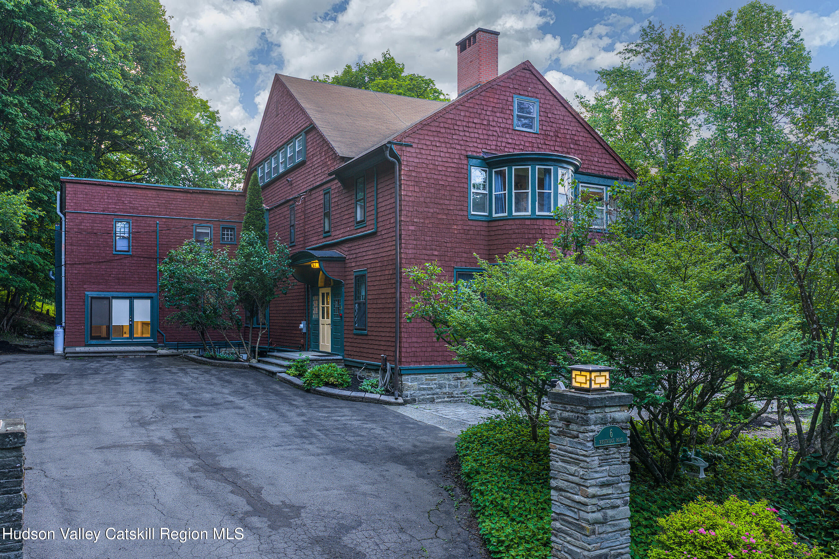 6 Westridge Road Cooperstown, NY 13326 - Photo 28 of 119 a front view of a house with a yard and garage