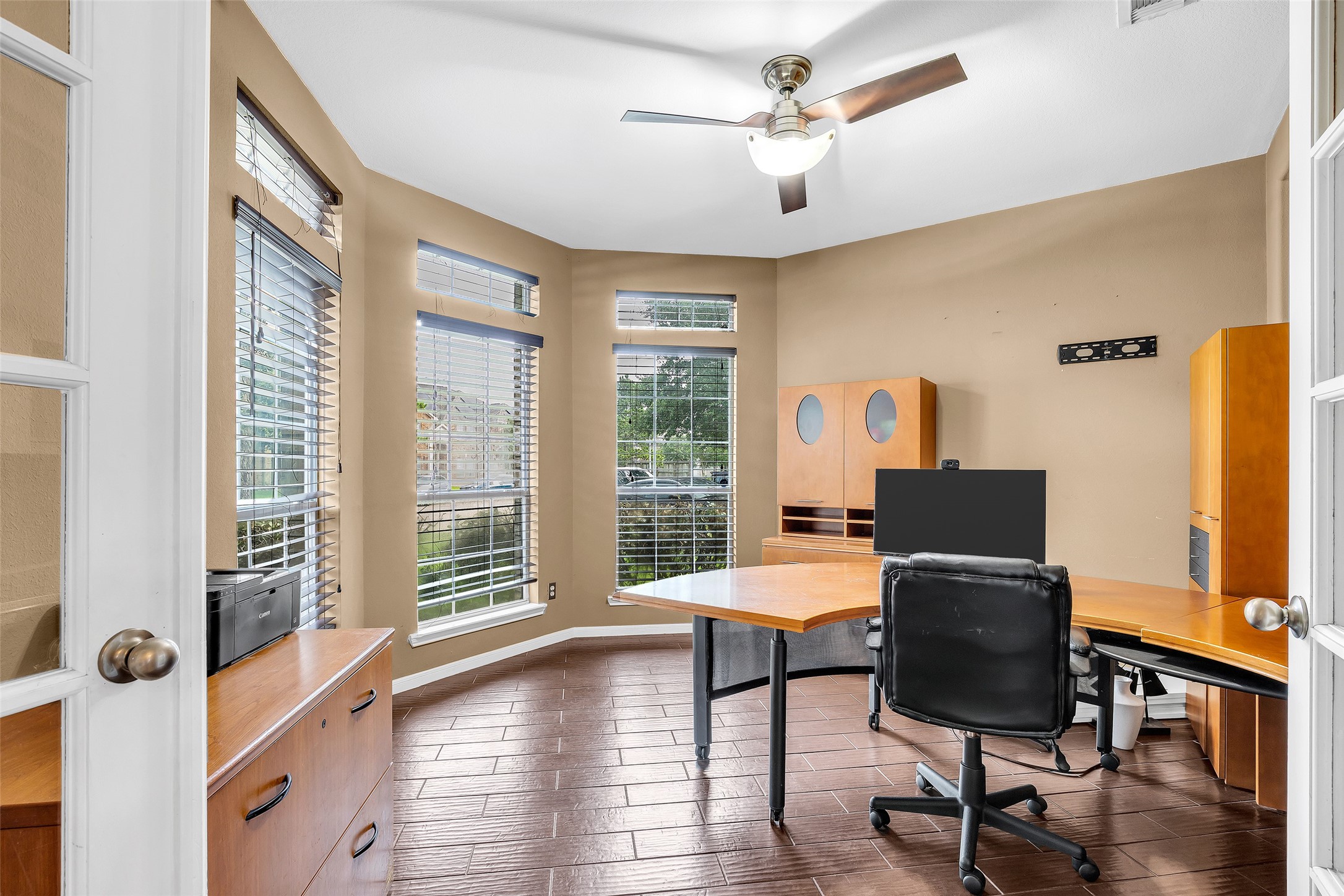 611 River Delta Lane Rosenberg, TX 77469 - Photo 12 of 39 a view of a workspace with furniture and a window