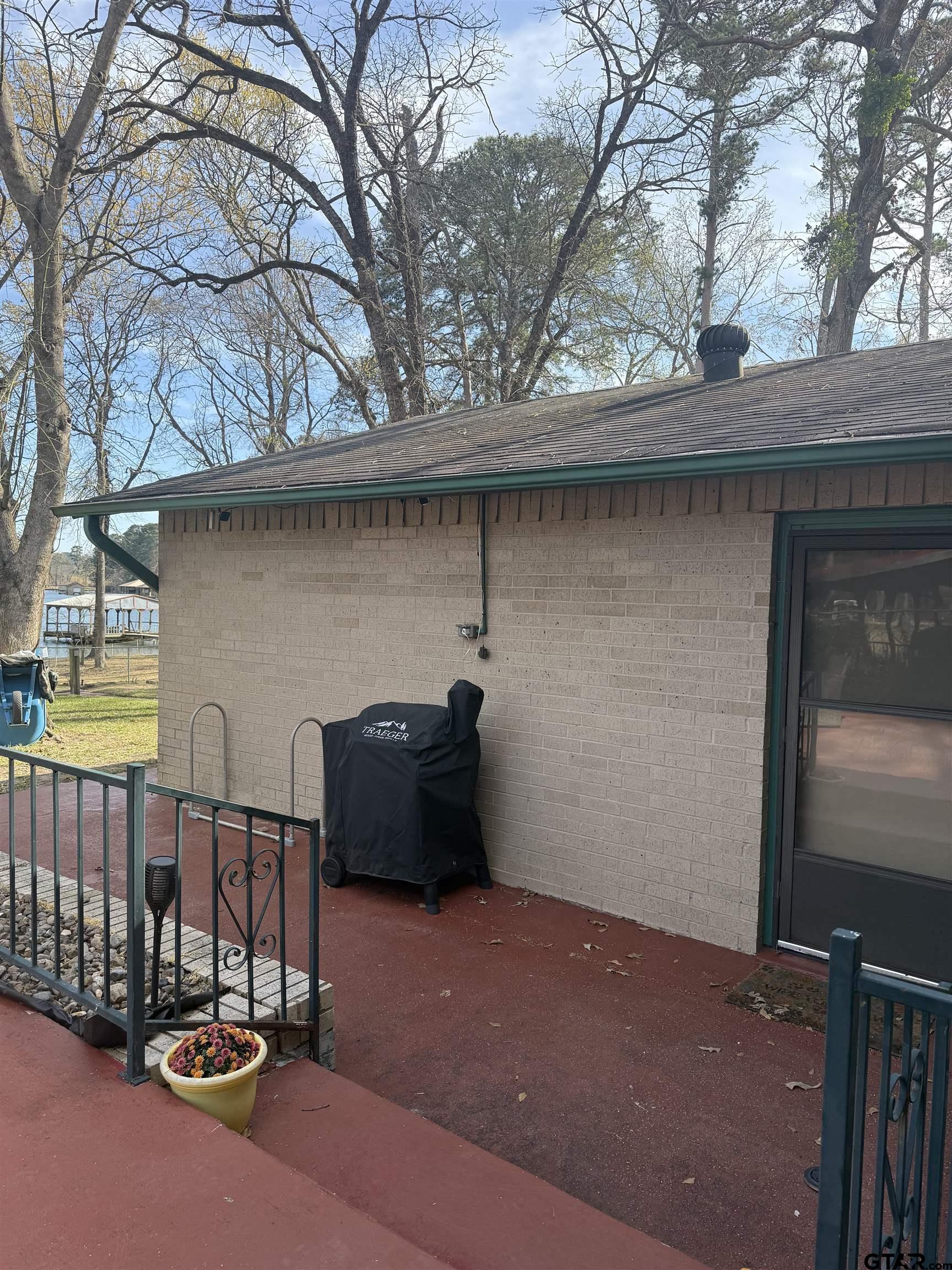 22571 Waterview Circle Flint, TX 75762 - Photo 13 of 41 a view of a patio with iron fence
