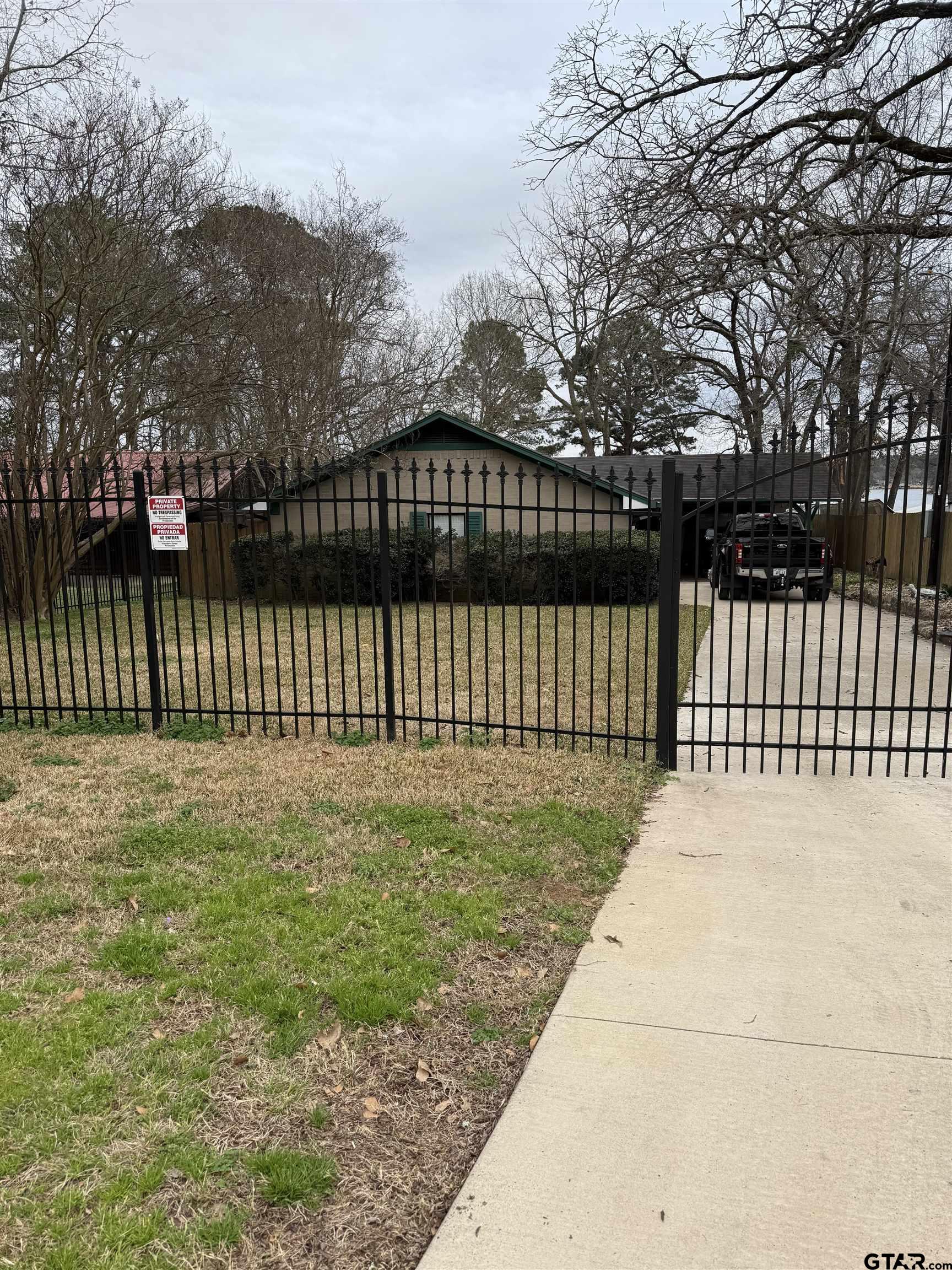 22571 Waterview Circle Flint, TX 75762 - Photo 2 of 41 a view of a yard with wooden fence
