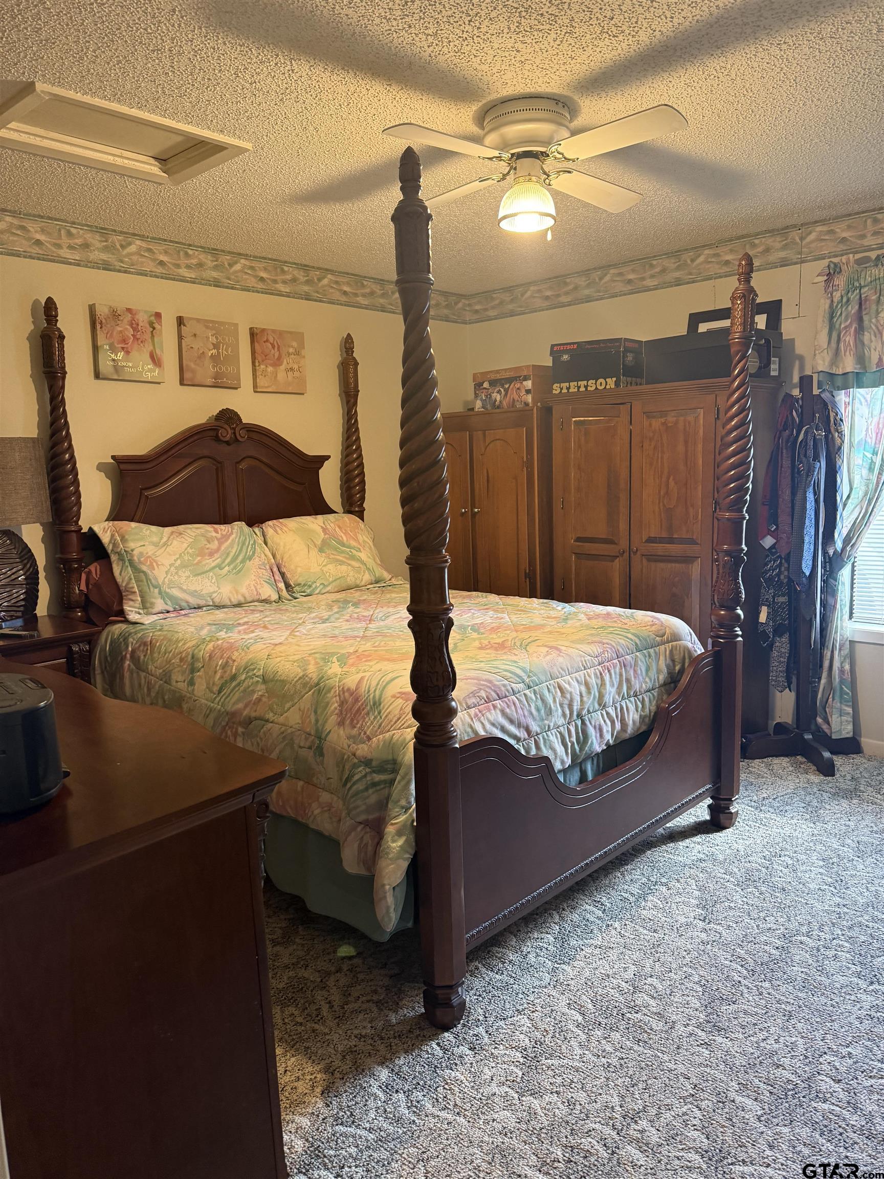 22571 Waterview Circle Flint, TX 75762 - Photo 21 of 41 a bedroom with a bed and a walk in closet