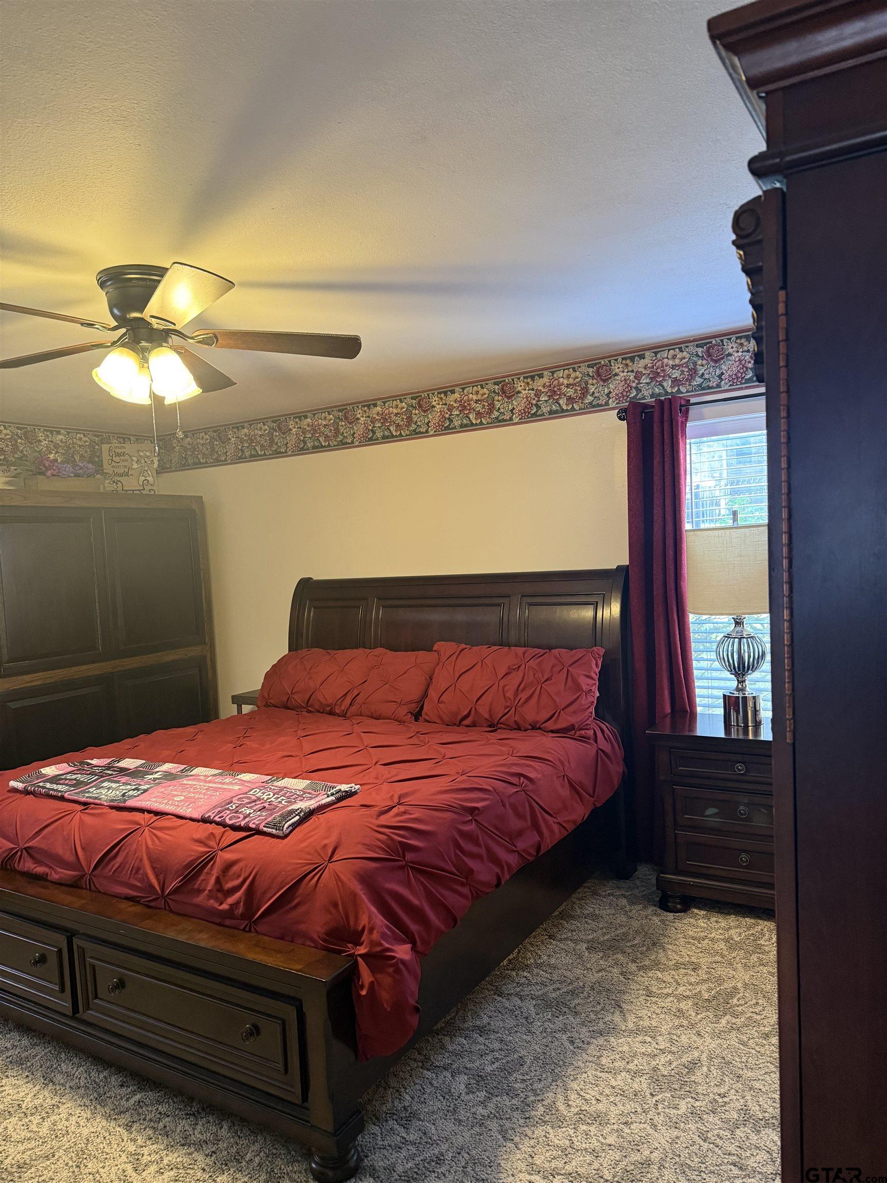 22571 Waterview Circle Flint, TX 75762 - Photo 22 of 41 a bedroom with a bed and lamp