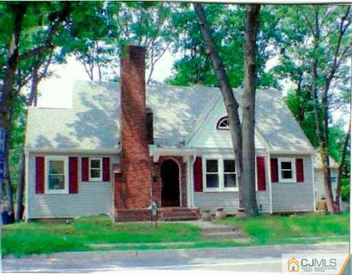 889 Englishtown Road Old Bridge, NJ 08857 - Photo 1 of 8 a front view of a house with a garden and tree