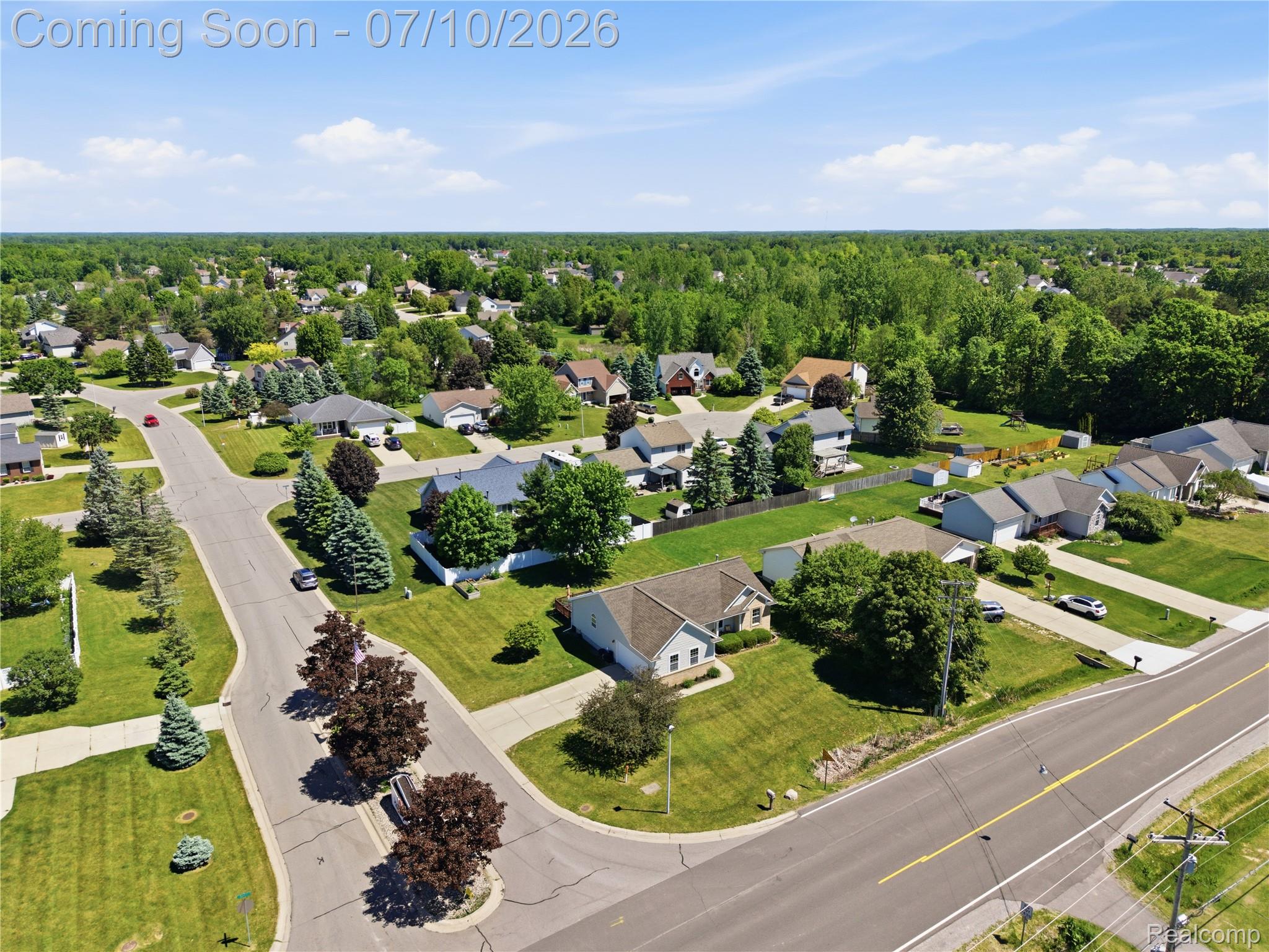 5275 East Maple Avenue Grand Blanc, MI 48439 - Photo 51 of 53 Expansive aerial perspective showcasing a residential development with established landscaping and mature trees