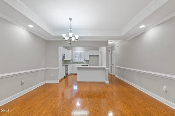 a view of livingroom with kitchen and fireplace