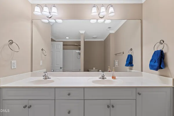 a view of a hallway with wooden floor and closet
