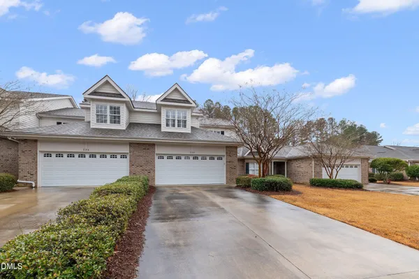 a view of a house with yard and plants