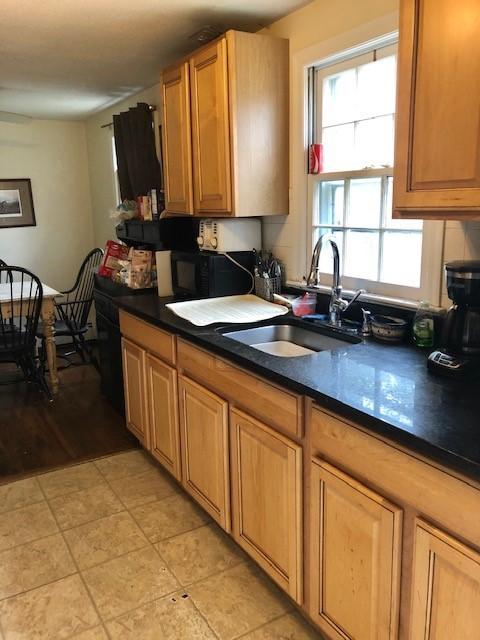 71 Lower Brook Road South Yarmouth, MA 02664 - Photo 5 of 6 a kitchen with stainless steel appliances a sink window and cabinets