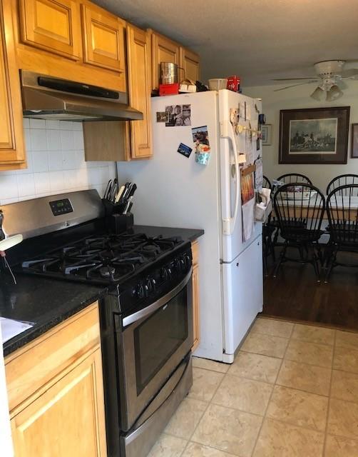 71 Lower Brook Road South Yarmouth, MA 02664 - Photo 6 of 6 a white refrigerator freezer sitting inside of a kitchen