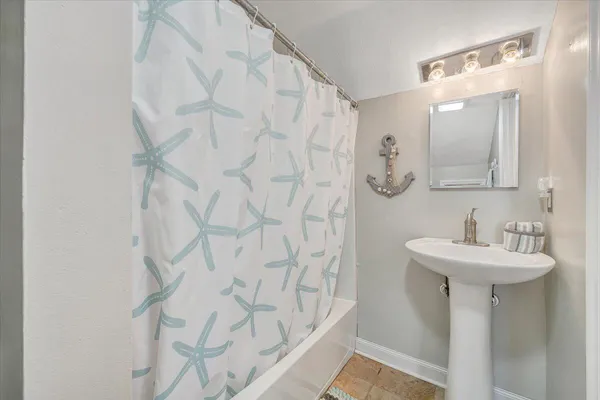 a bathroom with a sink and mirror