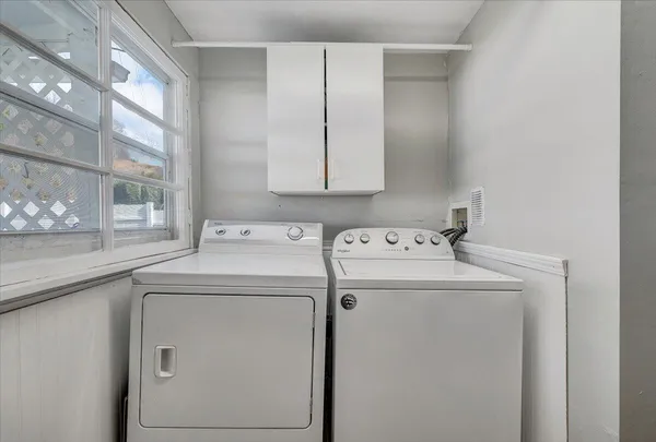 a utility room with dryer and washer