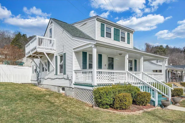 front view of a house with a yard