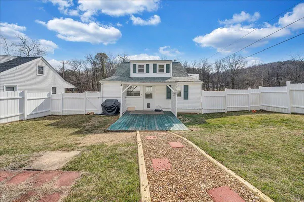 a view of a house with a yard