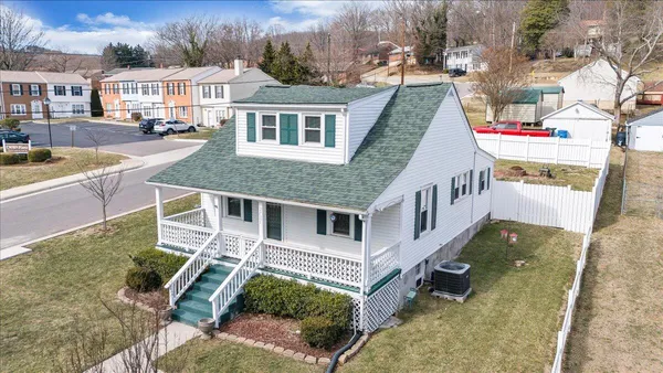 a aerial view of a house with swimming pool