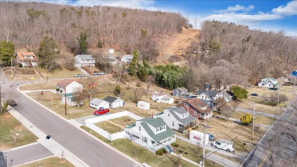 a picture of a wall with a white wall and a potted plant